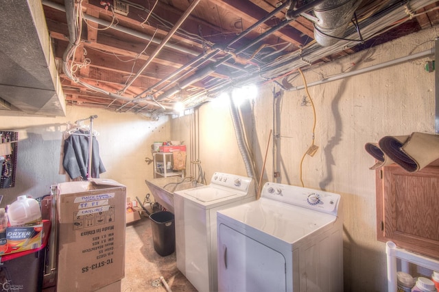 laundry room featuring laundry area, a sink, and washer and clothes dryer