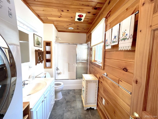 full bath featuring wooden ceiling, toilet, wooden walls, shower / bath combination with glass door, and vanity