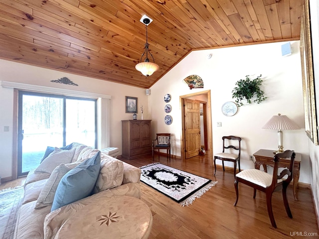 living area featuring lofted ceiling, wood ceiling, and wood finished floors