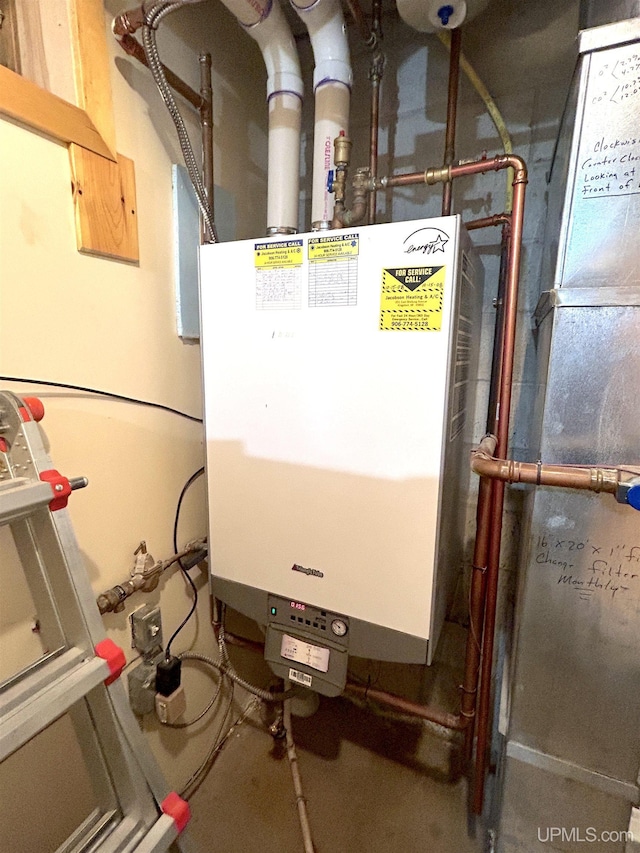 utility room featuring tankless water heater