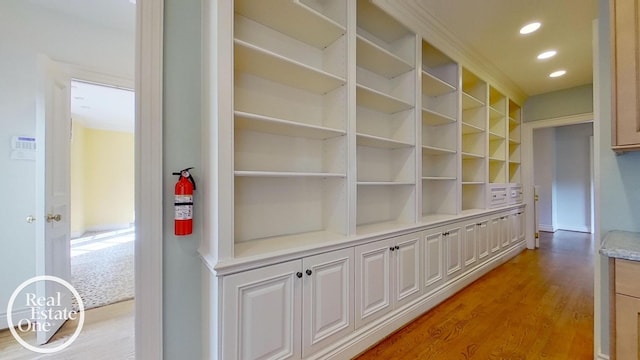 hall featuring recessed lighting and light wood-style flooring