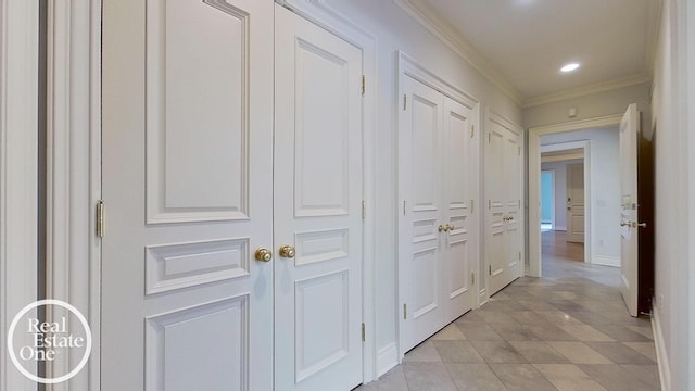 hall featuring baseboards, recessed lighting, and crown molding