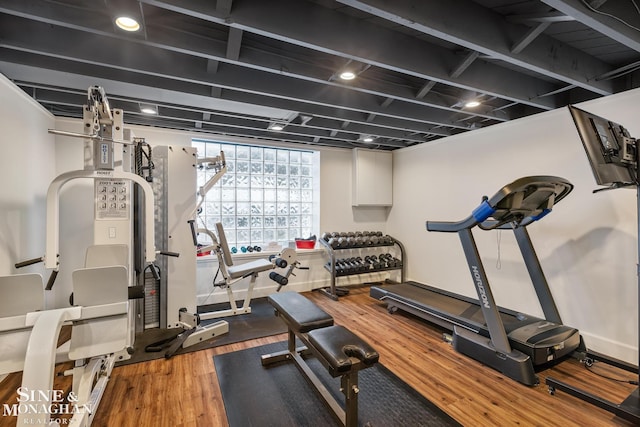 workout area with wood finished floors and baseboards