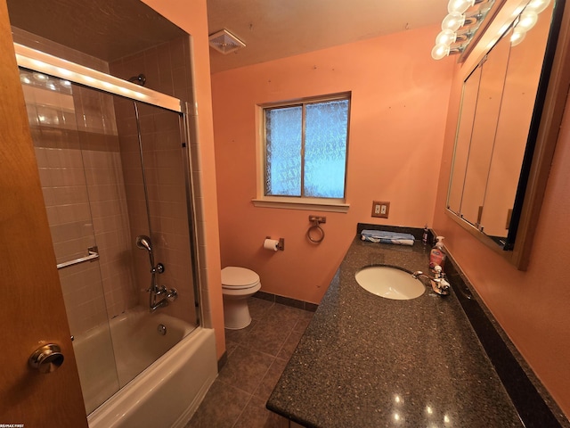 bathroom with visible vents, toilet, combined bath / shower with glass door, baseboards, and tile patterned floors