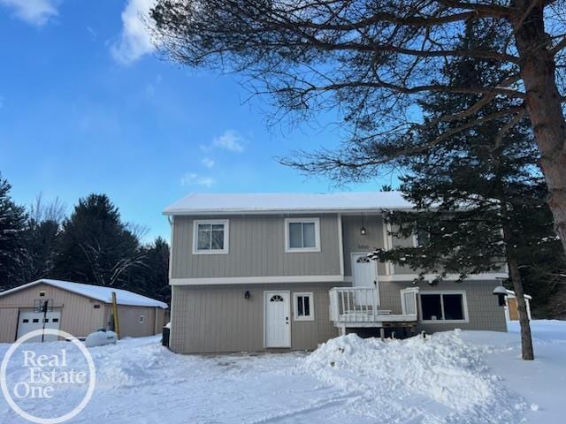 split foyer home with an outbuilding and a detached garage