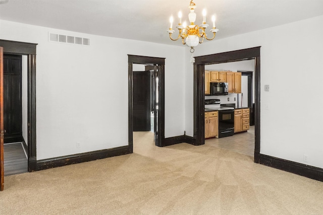 unfurnished room with baseboards, visible vents, a notable chandelier, and light colored carpet