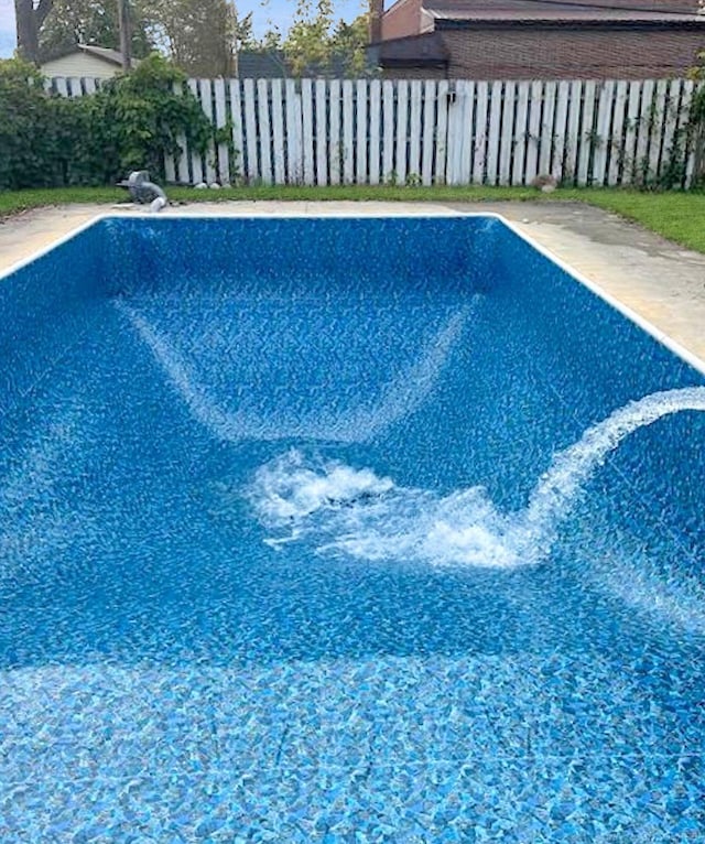 view of swimming pool with fence and a fenced in pool