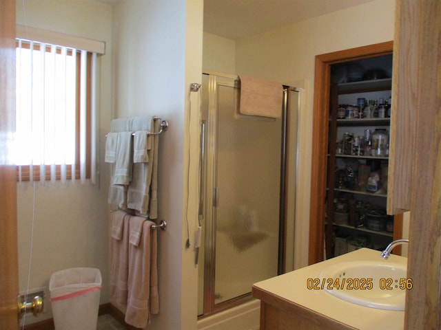 full bathroom featuring a stall shower and vanity