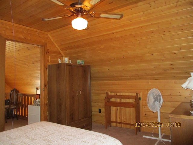 bedroom with lofted ceiling, wooden ceiling, and wood walls