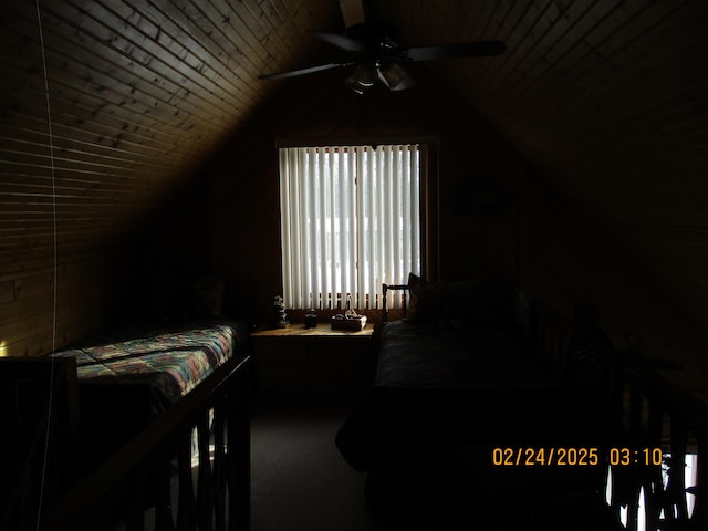 bedroom featuring a ceiling fan, wooden ceiling, and vaulted ceiling