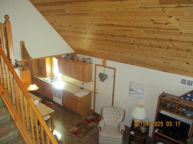 interior space with wood ceiling, visible vents, and stairway