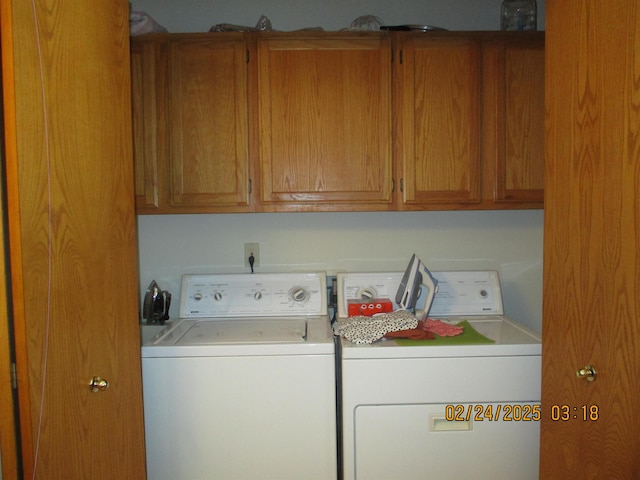 laundry room with cabinet space and washer and dryer