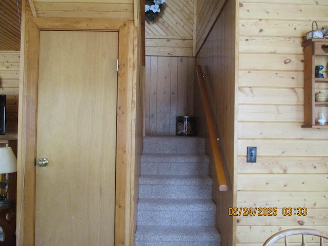 stairway with wooden walls