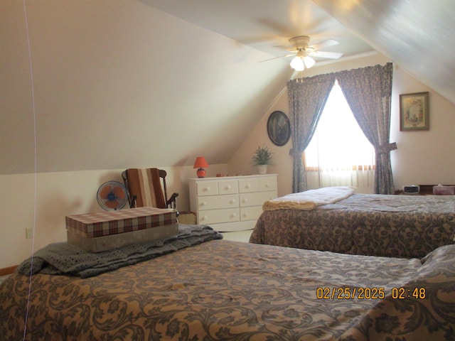 bedroom with vaulted ceiling and a ceiling fan