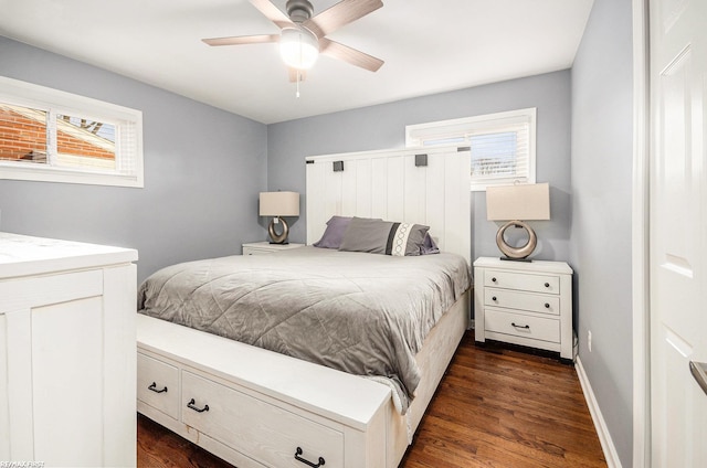 bedroom featuring a ceiling fan, dark wood finished floors, and baseboards