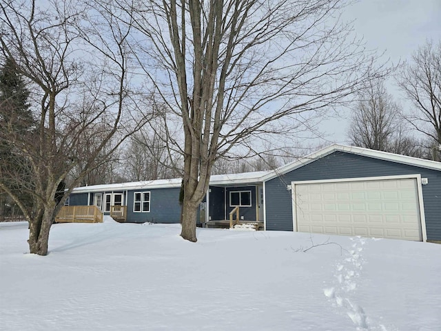 view of front of home with covered porch and an attached garage