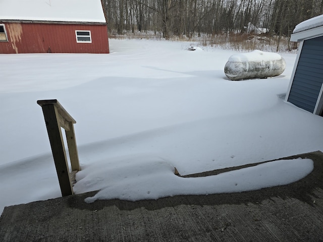 view of yard layered in snow