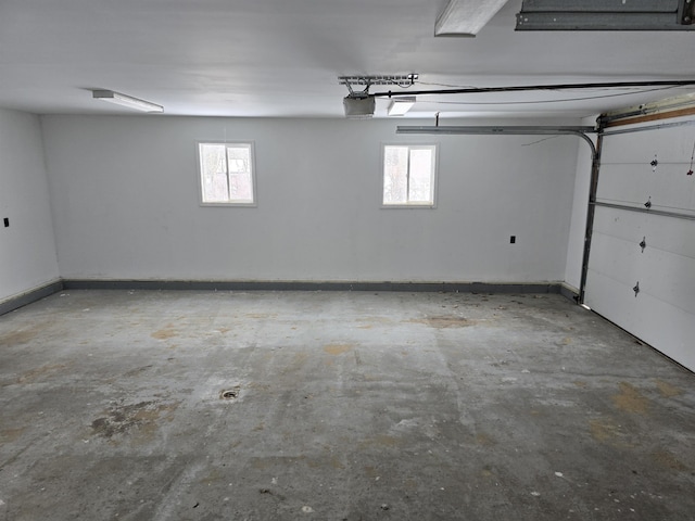 parking deck with a garage door opener and baseboards