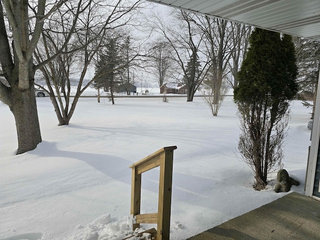 view of yard covered in snow