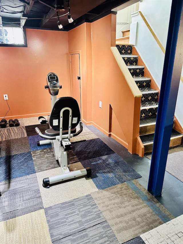 exercise area with baseboards