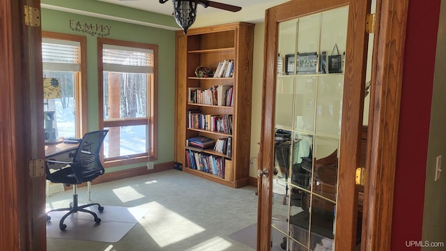 home office featuring baseboards, light colored carpet, and french doors