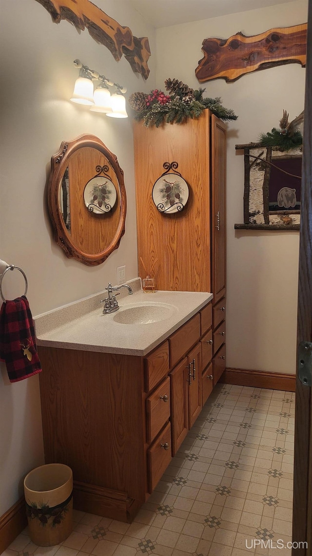 bathroom featuring vanity and baseboards