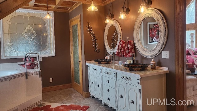 full bath featuring vanity, coffered ceiling, beamed ceiling, baseboards, and tile patterned floors