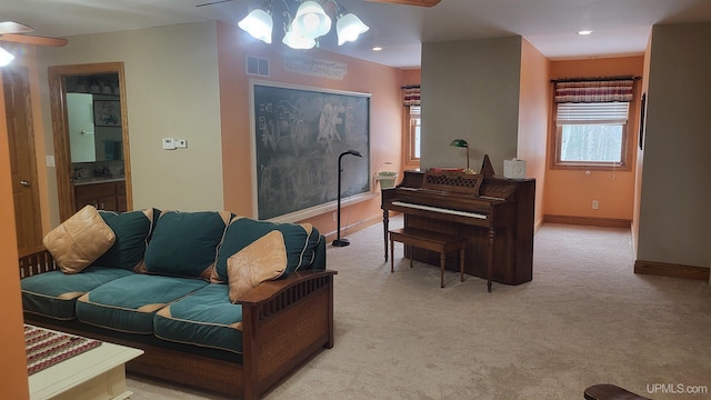 living room with light carpet, baseboards, visible vents, a ceiling fan, and recessed lighting