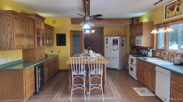 kitchen with glass insert cabinets, brown cabinetry, a sink, beverage cooler, and white appliances