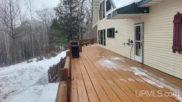 view of snow covered deck