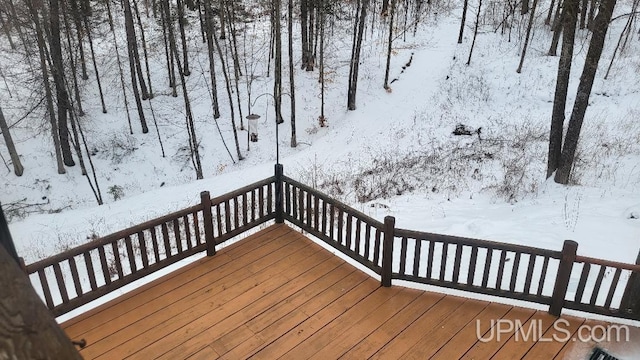 view of snow covered deck