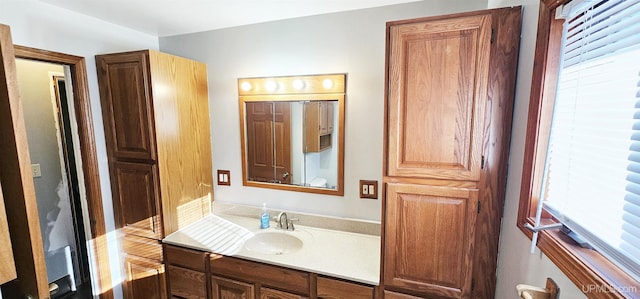 bathroom with plenty of natural light and vanity