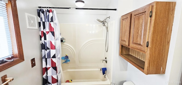 bathroom featuring shower / bath combination with curtain