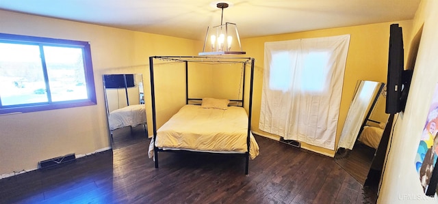 bedroom featuring dark wood-style flooring and visible vents