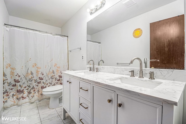 full bath with marble finish floor, double vanity, a sink, and visible vents