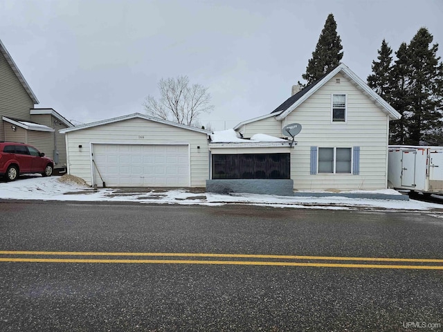 view of front of home with a garage and concrete driveway