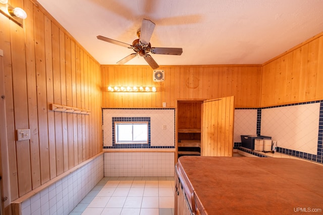 kitchen with a ceiling fan, visible vents, and light tile patterned floors