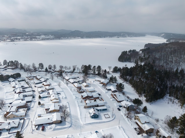 snowy aerial view with a residential view