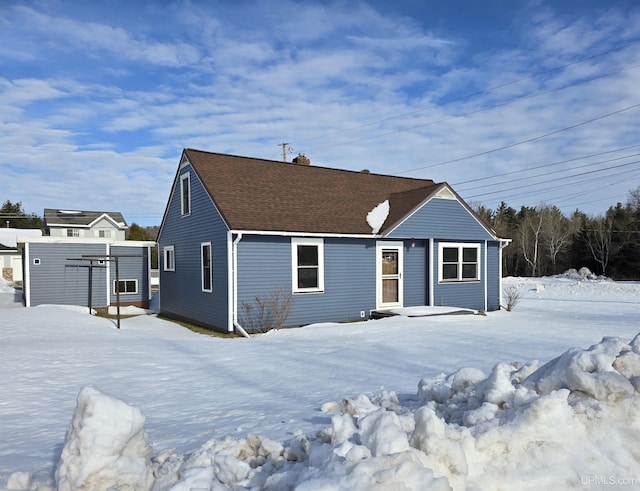 exterior space with a shingled roof