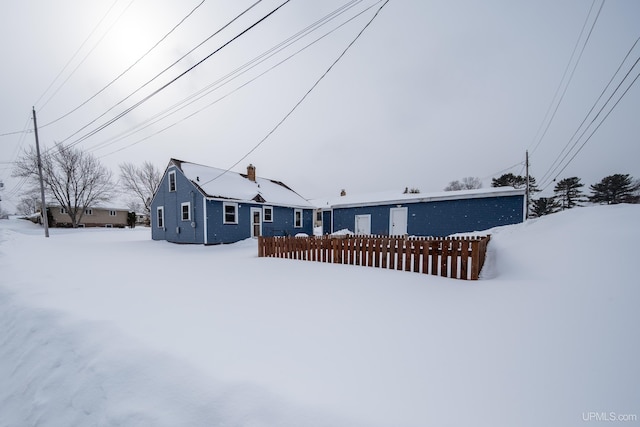 view of front of house featuring fence