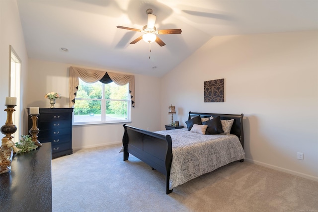 bedroom featuring baseboards, vaulted ceiling, and light colored carpet