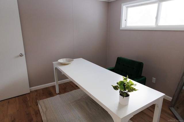 office space featuring baseboards and dark wood-style flooring