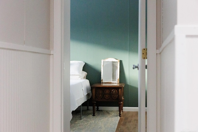 bedroom with wood finished floors