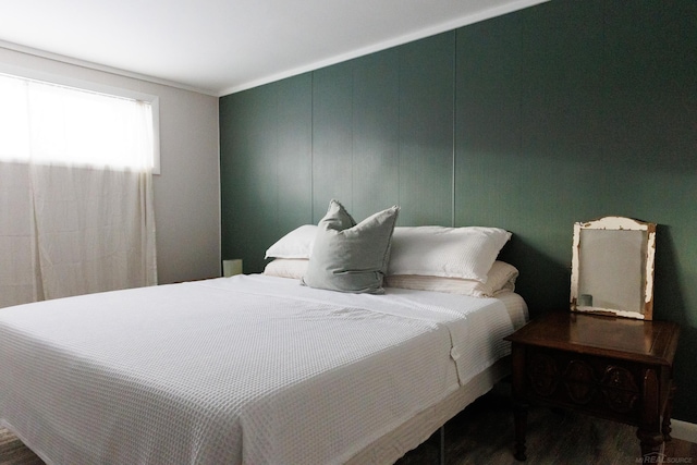 bedroom with wood finished floors