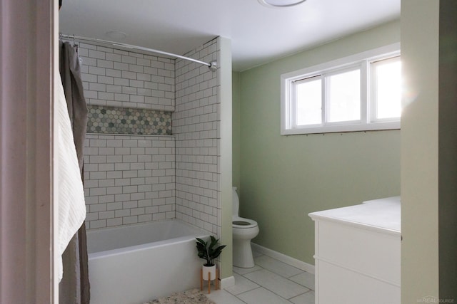 bathroom featuring shower / tub combination, toilet, and baseboards