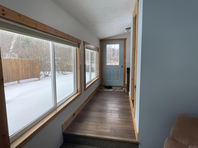 sunroom / solarium with vaulted ceiling