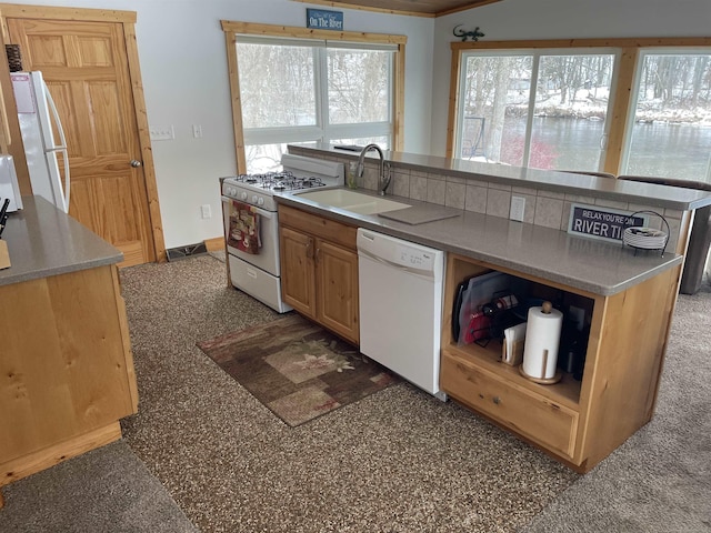 kitchen with open shelves, white appliances, a sink, and baseboards