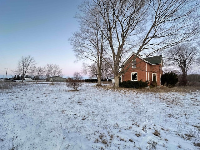 view of yard covered in snow