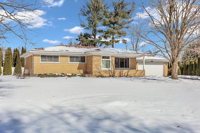 single story home with brick siding and an attached garage