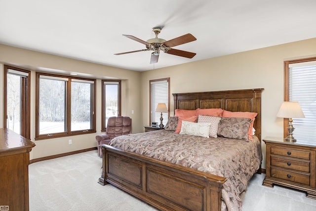 bedroom featuring a ceiling fan, access to outside, light colored carpet, and baseboards